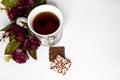 Cup with beautiful cookies on a white background