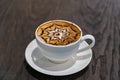 Cup of beautiful hot mocha art latte coffee on table Royalty Free Stock Photo