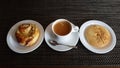 Cup of black aromatic coffee and two cakes are prepared for breakfast Royalty Free Stock Photo