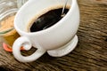 Cup of black coffee, brown sugar on the wooden table Royalty Free Stock Photo