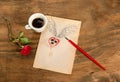 Cup of black coffee with coffee beans heart with wings drawn in pencil and red rose . Royalty Free Stock Photo