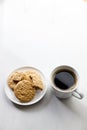 Cup of black coffee, Cookies on white marble background. Copy space. Flat lay. Top view Royalty Free Stock Photo