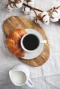 Cup of black coffee with croissant and milk on  table. Royalty Free Stock Photo