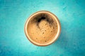 A cup of black coffee with froth, a close-up, overhead flat lay shot Royalty Free Stock Photo