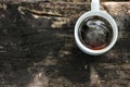 Cup of black coffee with light steam on wooden background Royalty Free Stock Photo