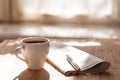 Cup of black coffee, newspaper and a pen against Royalty Free Stock Photo
