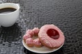 Cup of black coffee with pink donuts Royalty Free Stock Photo