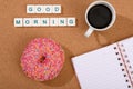 Good morning with coffee, donut and notebook