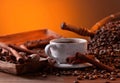 Cup of black coffee, roasted beans and spices Royalty Free Stock Photo