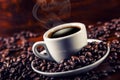 Cup of black coffee and spilled coffee beans. Royalty Free Stock Photo