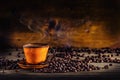 Cup of black coffee and spilled coffee beans. Coffee break Royalty Free Stock Photo