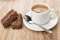 Cup of black coffee, spoon and two chocolate candies Royalty Free Stock Photo