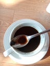A cup of black coffee with spooned pulp. Royalty Free Stock Photo