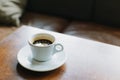 Cup of black coffee on a table in a cafe. Selective focus Royalty Free Stock Photo