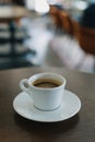 Cup of black coffee on a table in a cafe. Selective focus Royalty Free Stock Photo