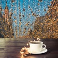 Cup of black coffee on wooden table in cafe. Christmas lights and gold garland on background Royalty Free Stock Photo