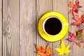 Cup with black coffee, wooden table with autumn fallen orange leaves Flat lay Top view Mock Royalty Free Stock Photo