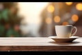 Cup of black coffee on wooden table in cafe. Christmas lights and gold garland on background. Royalty Free Stock Photo