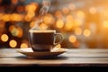 Cup of black coffee on wooden table in cafe. Christmas lights and gold garland on background. Royalty Free Stock Photo