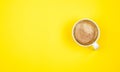 A cup of black coffee on yellow background. View from above. copy space Royalty Free Stock Photo