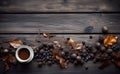 Cup of black coffee and autumn leaves and fruits on wooden table in vintage style.