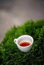 Cup of black filter coffee on the grass nature street cafe pour over alternative