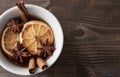Cup of black tea with anise, cinnamon and dried oranges