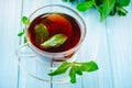 Cup of black tea with fresh mint Royalty Free Stock Photo