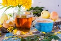 A cup of black tea and jam from pears in a bowl Royalty Free Stock Photo