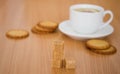 Cup of black tea with lemon, sugar and biscuits Royalty Free Stock Photo