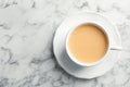 Cup with black tea and milk on marble table Royalty Free Stock Photo