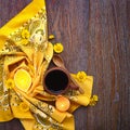 Cup of black tea with yellow daisy flowers on wooden background. Royalty Free Stock Photo