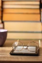 Cup, Books, E-Reader and Glasses Royalty Free Stock Photo