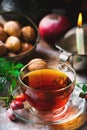 Cup of briar tea on a Christmas rustic background.