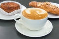 Cup of Caffe Latte with Pastry Background Royalty Free Stock Photo