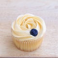 Cup-cake close-up with blueberry on top