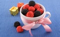 The cup with candy and pink bow Royalty Free Stock Photo