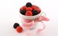 The cup with candy and pink bow Royalty Free Stock Photo
