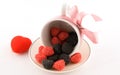 He cup with candy and pink bow Royalty Free Stock Photo