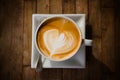 cup of cappucchino over wooden table Royalty Free Stock Photo
