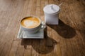 cup of cappucchino over wooden table Royalty Free Stock Photo
