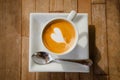 cup of cappucchino over wooden table Royalty Free Stock Photo