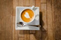 cup of cappucchino over wooden table Royalty Free Stock Photo