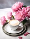 Cup of cappuccino and bouquet of pink peonies.