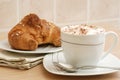 Cup of cappuccino and brioche Royalty Free Stock Photo