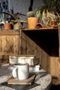 cup with cappuccino coffee and books on an old table with a background of old rustic woods Royalty Free Stock Photo