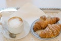 Cup of cappuccino coffee and croissant - italian breakfast Royalty Free Stock Photo