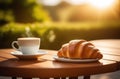 Cup of cappuccino coffee with croissant on wooden table Royalty Free Stock Photo