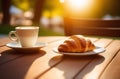 Cup of cappuccino coffee with croissant on wooden table Royalty Free Stock Photo