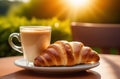 Cup of cappuccino coffee with croissant on wooden table Royalty Free Stock Photo